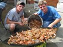 Lawrence and Blake serving up New Orleans boilded crabs